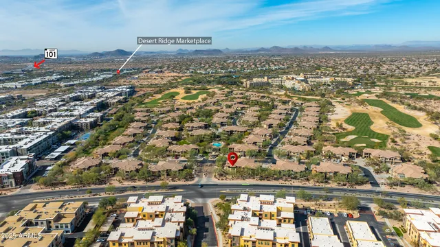a view of a house with backyard porch and sitting area