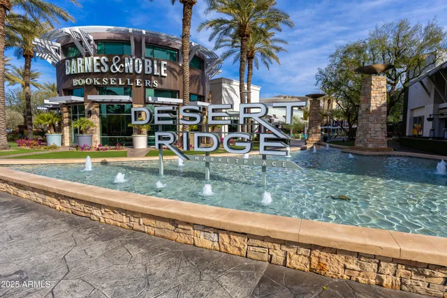 a swimming pool with outdoor seating and yard