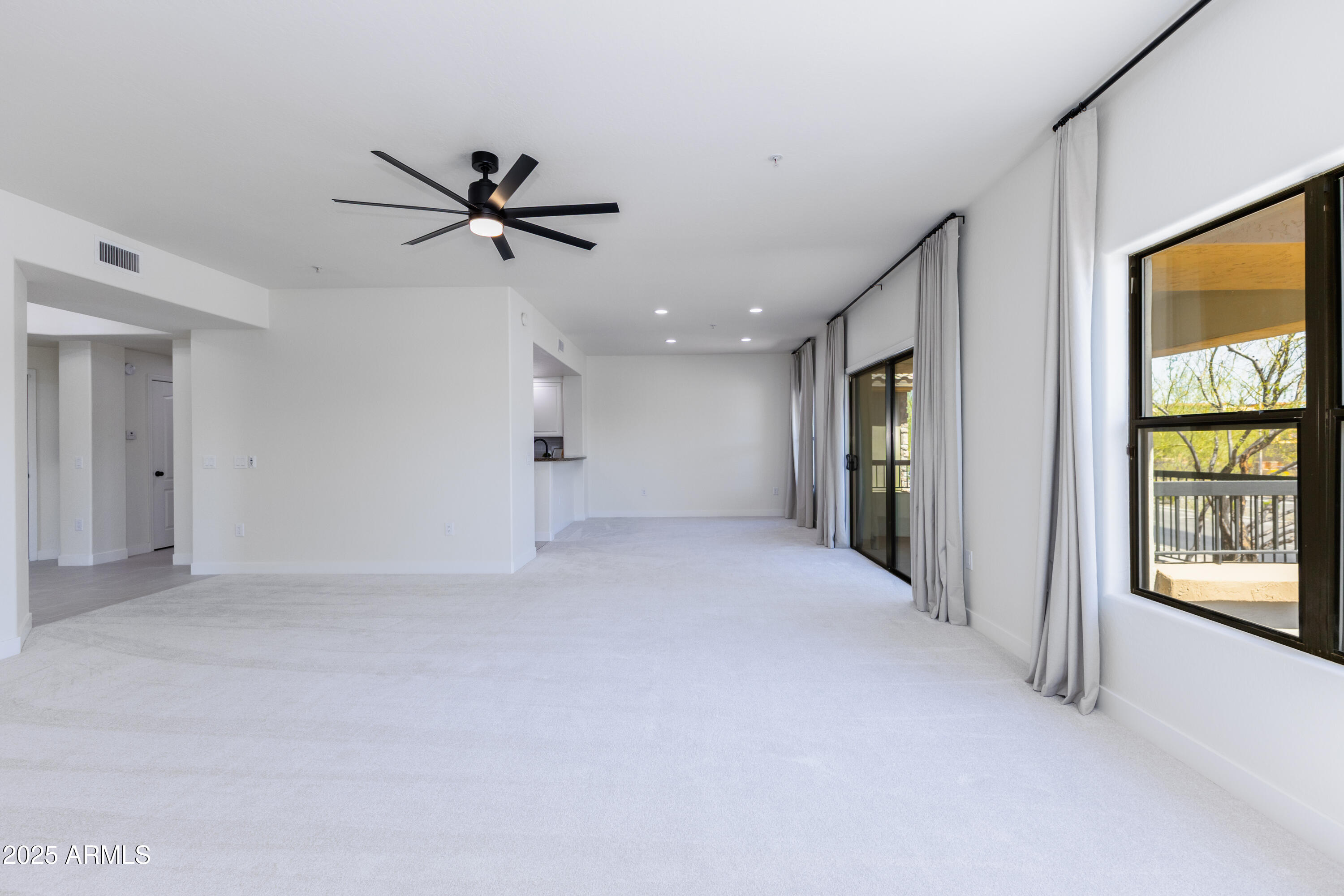 21320 North 56th Street, Unit 2001 Phoenix, AZ 85054 - Photo 6 of 45 wooden floor in an empty room with a window