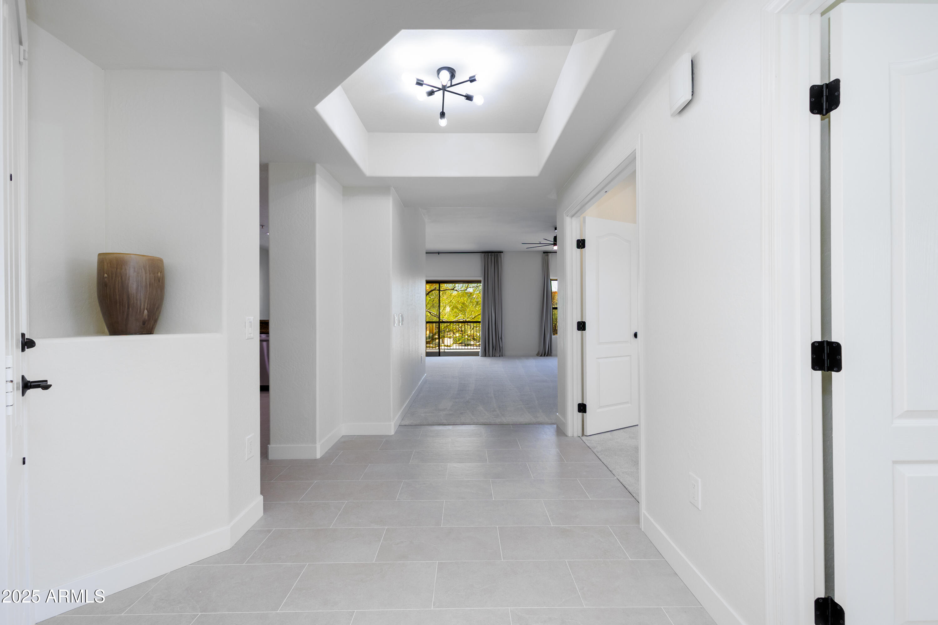 21320 North 56th Street, Unit 2001 Phoenix, AZ 85054 - Photo 7 of 45 a view of hallway with chandelier and entryway