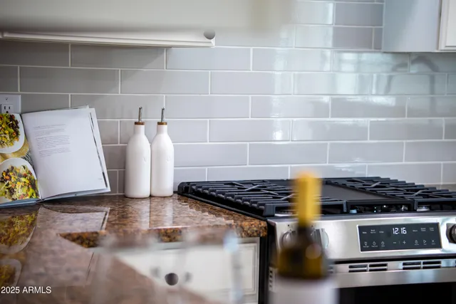 a kitchen with a stove and a cabinet