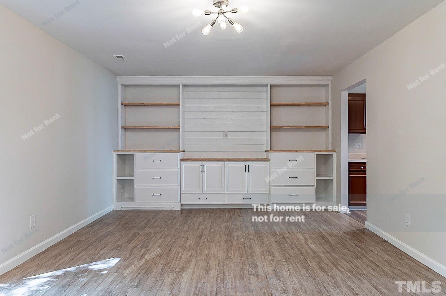 565 Darby Glen Lane Durham, NC 27713 - Photo 5 of 18 a view of walk in closet with empty racks