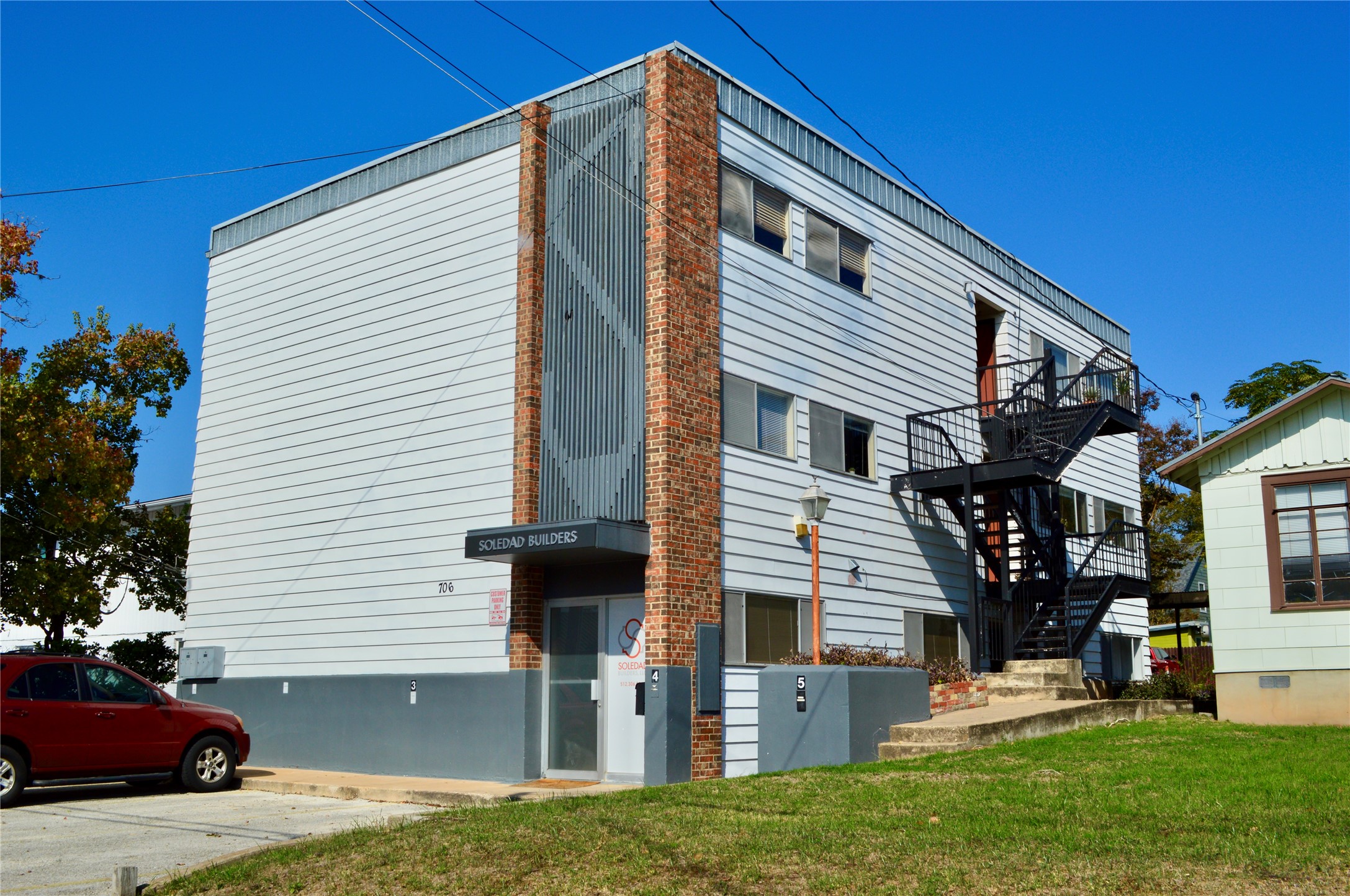 706 West 34th Street, Unit 102 Austin, TX 78705 - Photo 1 of 2 View of side of property featuring stairway