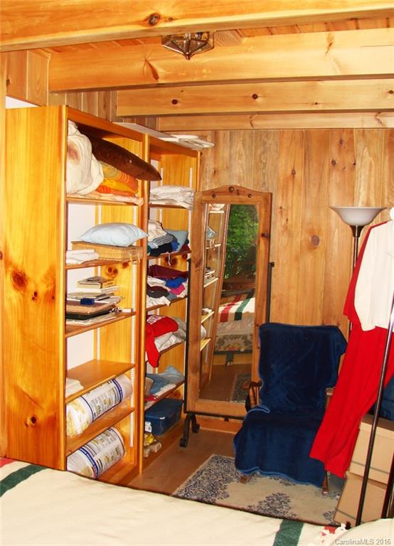 1083 Big Creek Road Marshall, NC 28753 - Photo 16 of 23 a view of walk in closet with clothes and shoes