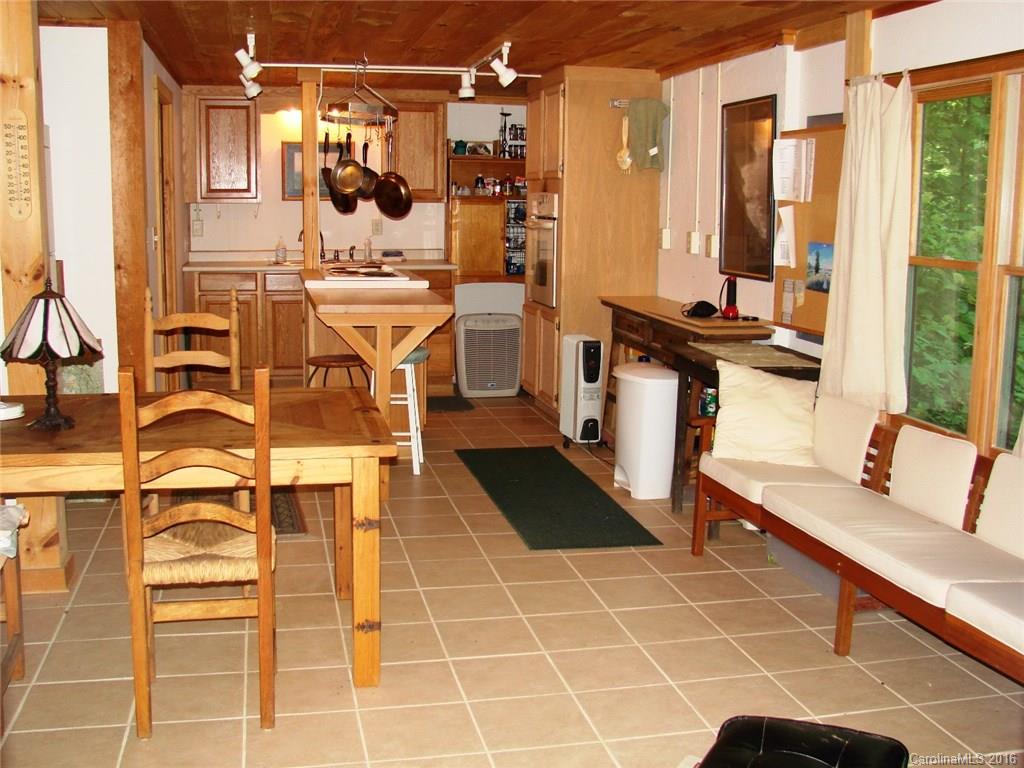 1083 Big Creek Road Marshall, NC 28753 - Photo 4 of 23 a kitchen with a sink and cabinets