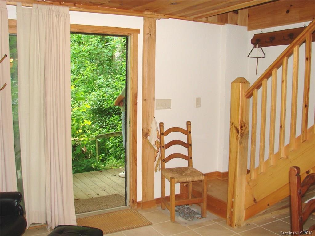 1083 Big Creek Road Marshall, NC 28753 - Photo 8 of 23 a view of a balcony with wooden floor and door