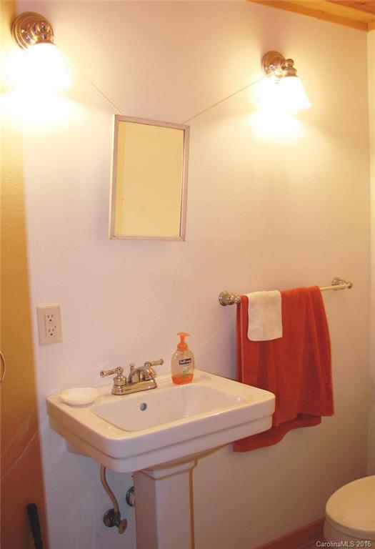 1083 Big Creek Road Marshall, NC 28753 - Photo 9 of 23 a bathroom with a sink and a toilet
