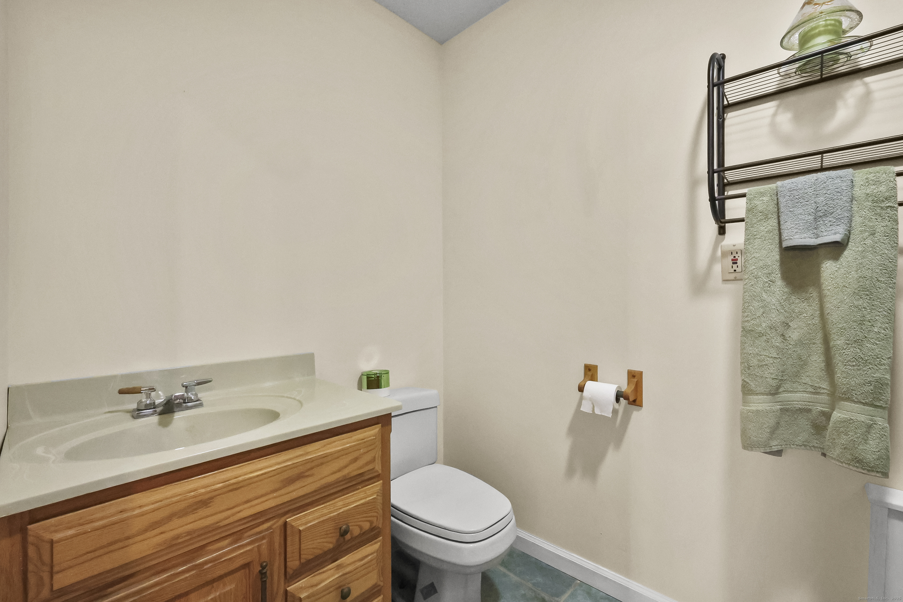 111 Bascom Road Lebanon, CT 06249 - Photo 12 of 30 a bathroom with a granite countertop sink toilet and shower