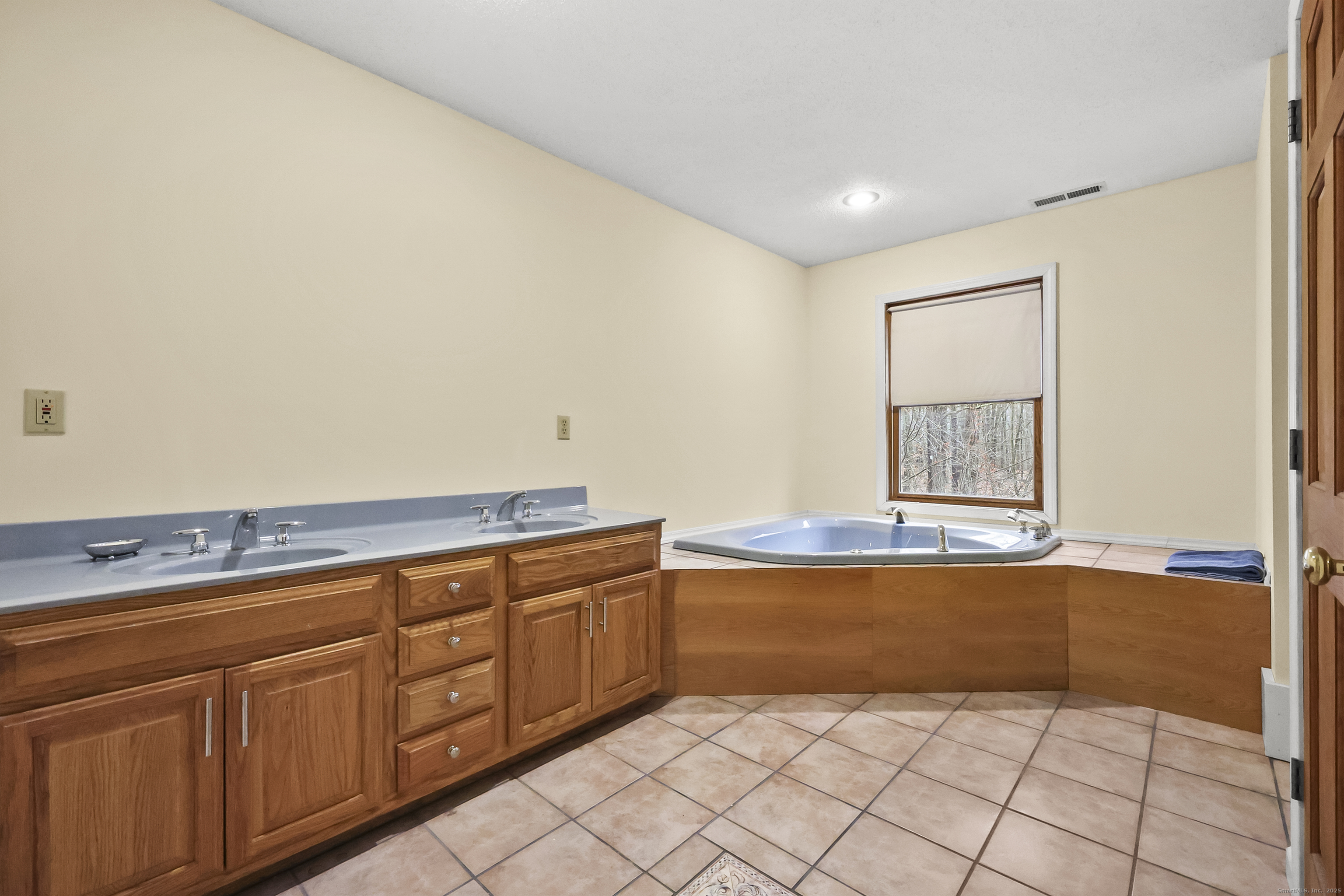111 Bascom Road Lebanon, CT 06249 - Photo 14 of 30 a view of a kitchen with stainless steel appliances granite countertop a sink and dishwasher with white cabinets