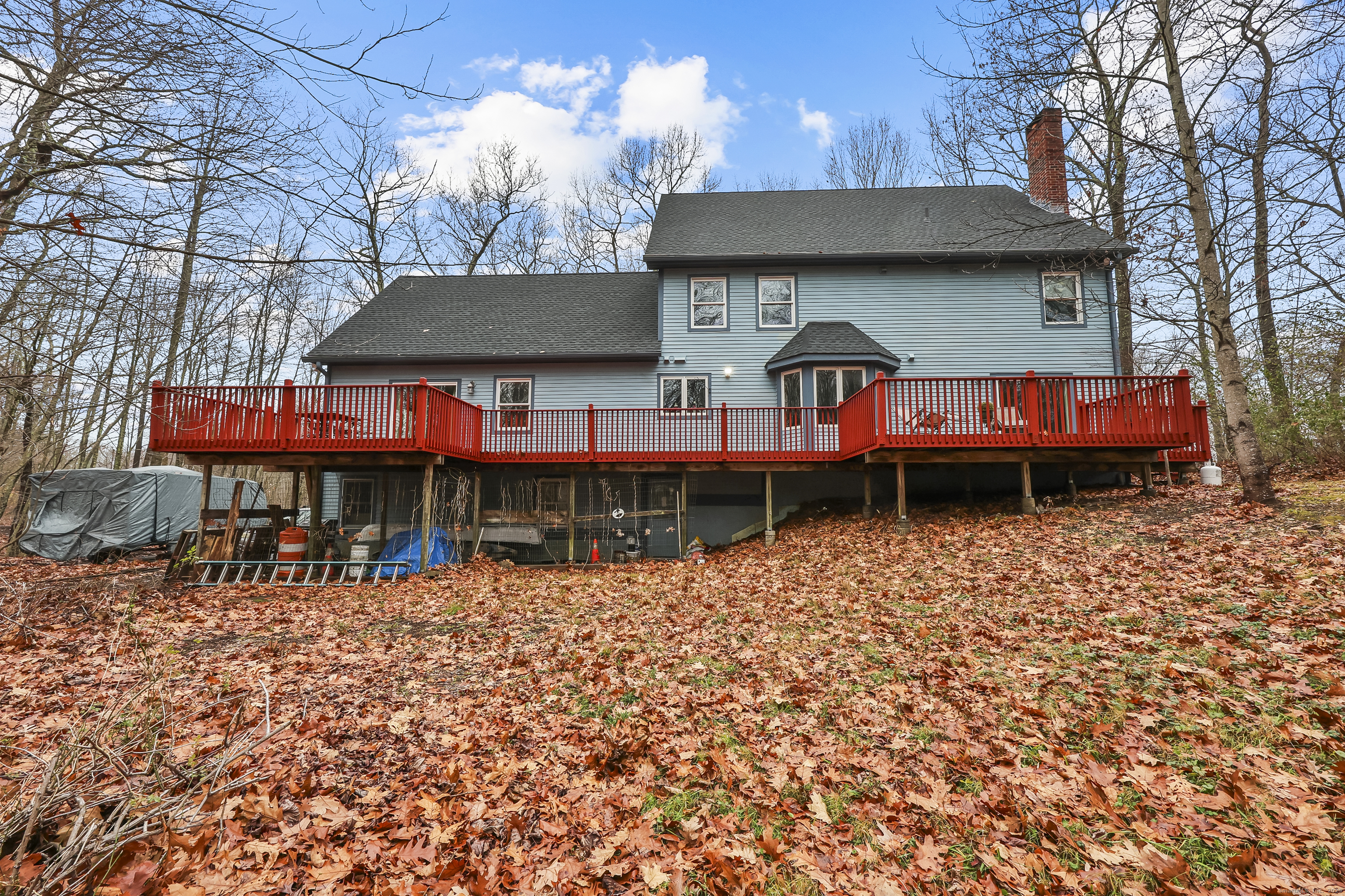 111 Bascom Road Lebanon, CT 06249 - Photo 2 of 30 a front view of a house with a garden and trees