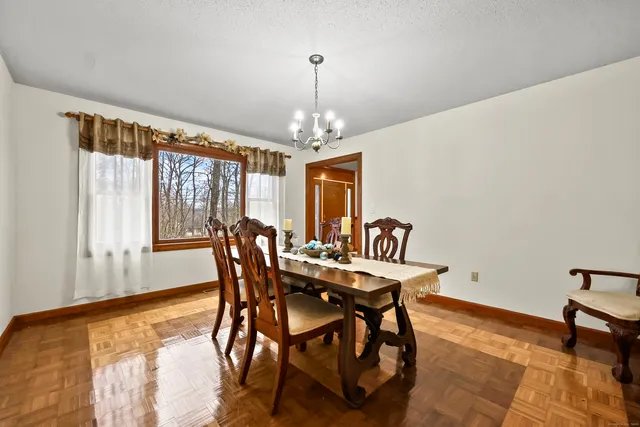 a view of a dining room with furniture window and outside view
