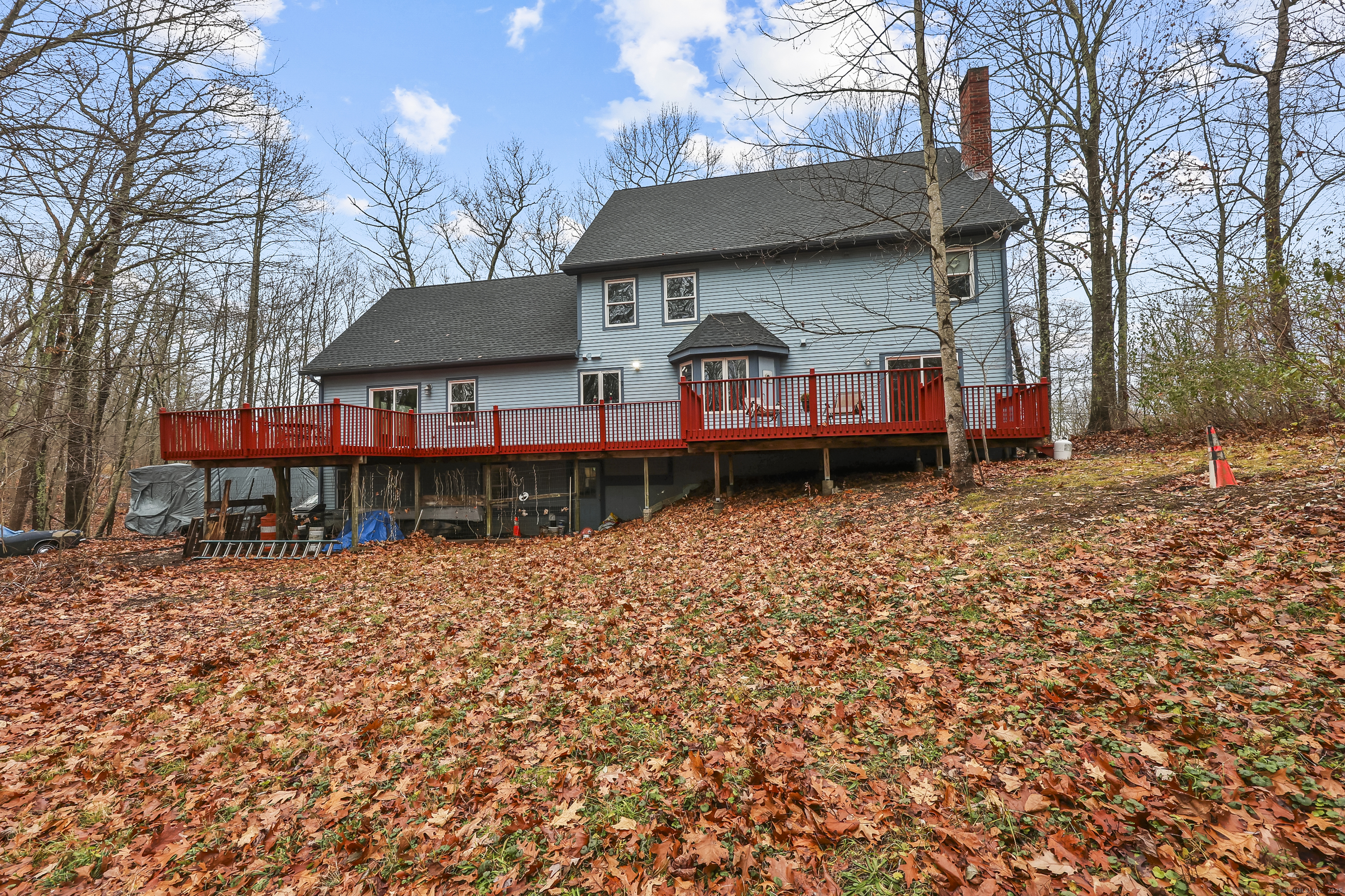 111 Bascom Road Lebanon, CT 06249 - Photo 3 of 30 a front view of a house with a yard and garage