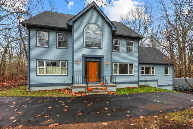 a front view of a house with yard