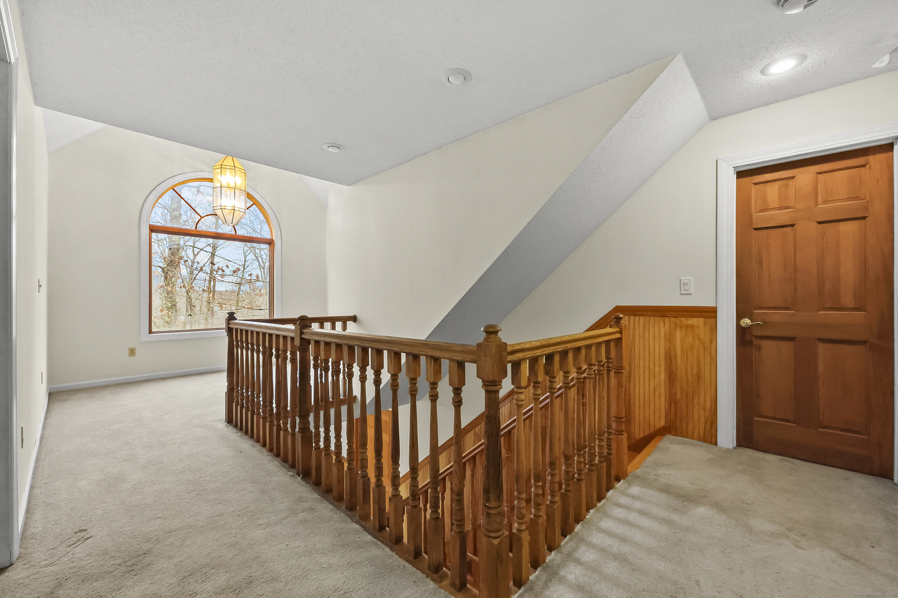 111 Bascom Road Lebanon, CT 06249 - Photo 6 of 30 a view of entryway with wooden floor and windows