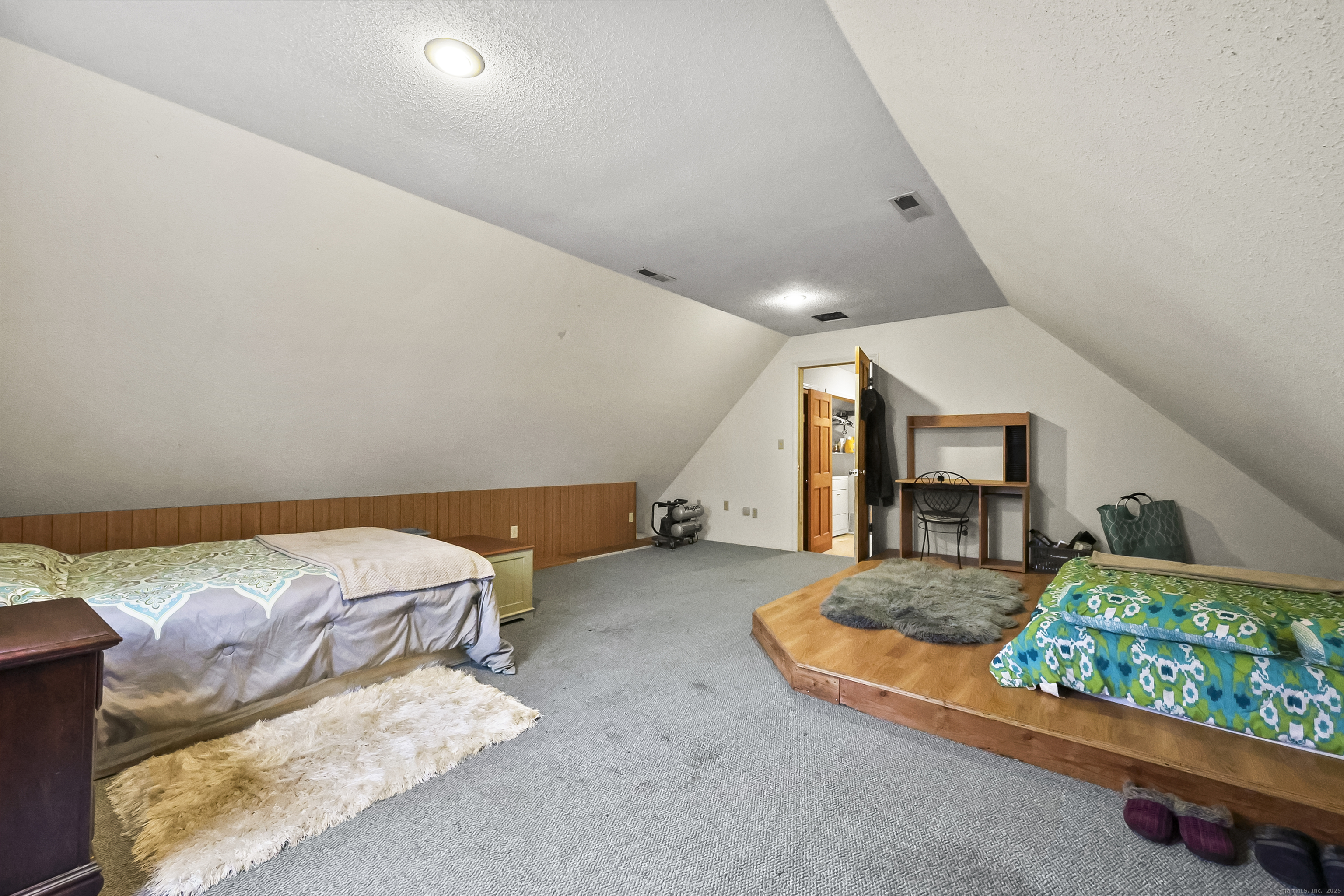 111 Bascom Road Lebanon, CT 06249 - Photo 7 of 30 a spacious bedroom with a bed and a table
