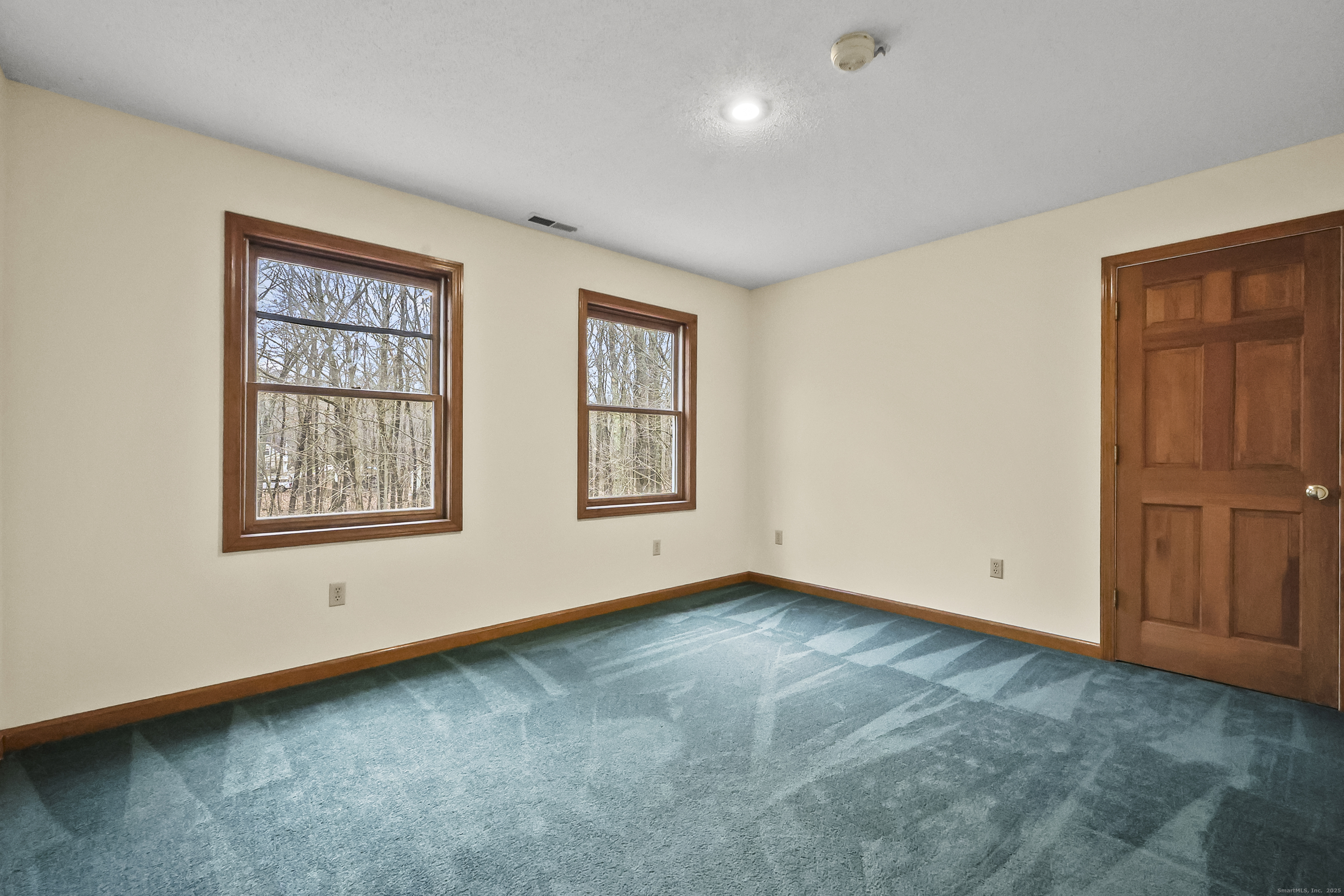 111 Bascom Road Lebanon, CT 06249 - Photo 10 of 30 an empty room with windows