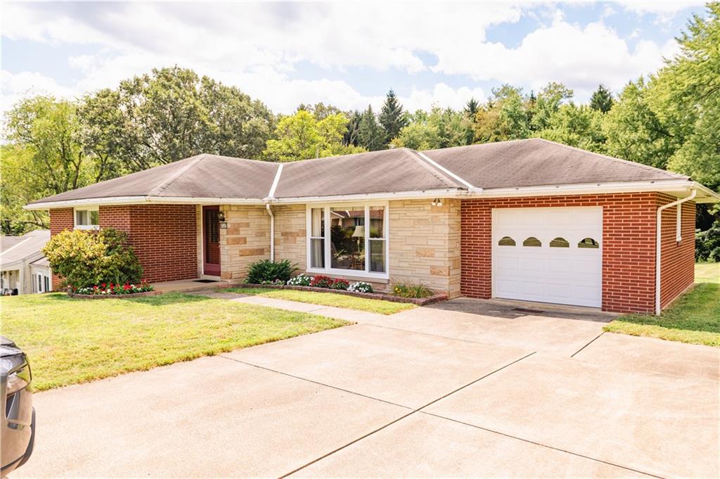 608 Edgewood Drive Apollo, PA 15613 - Photo 3 of 40 a house with a garden in front of it