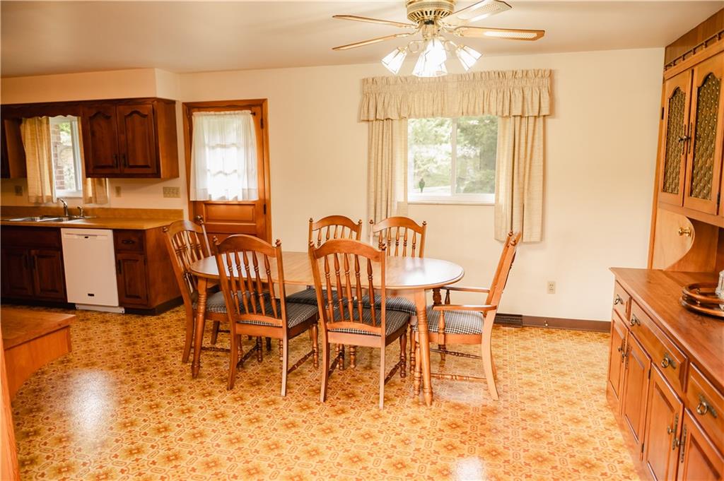 608 Edgewood Drive Apollo, PA 15613 - Photo 9 of 40 a dining room with furniture a chandelier and wooden floor
