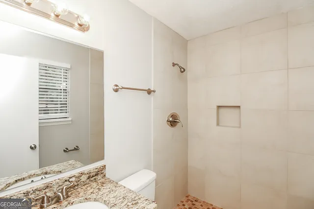 a bathroom with a sink and shower