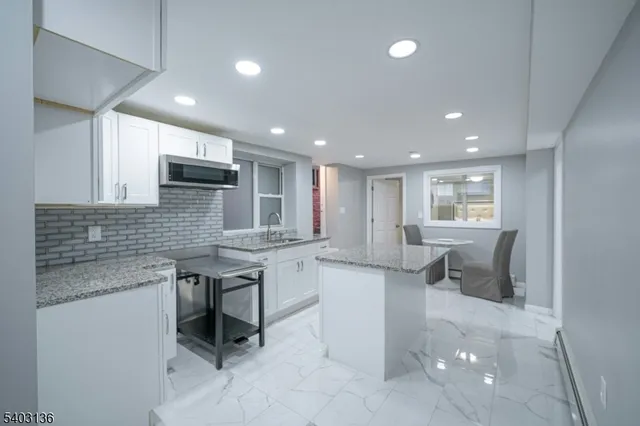 a kitchen with counter space cabinets and appliances