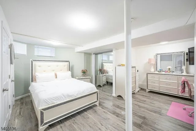 a bedroom with a bed and a view of bathroom