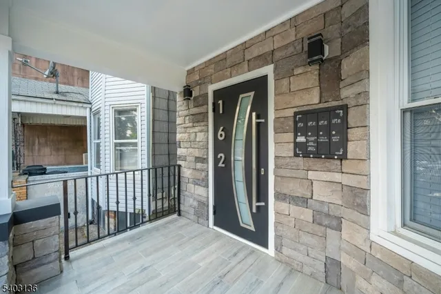 a view of a brick house with a large window