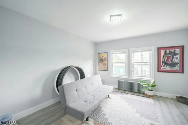 a living room with furniture and windows