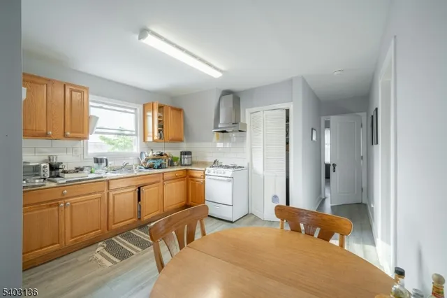 a bedroom with a bed and a view of kitchen