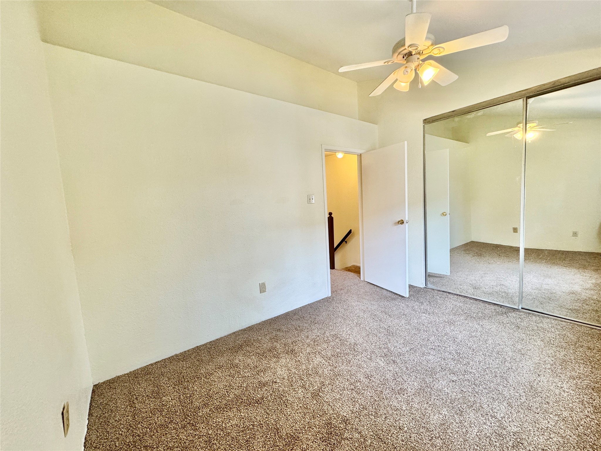 2002 Gentryside Drive, Unit 103 Houston, TX 77077 - Photo 11 of 20 High ceilings and mirrored closet doors enhances the sense of space in this bedroom