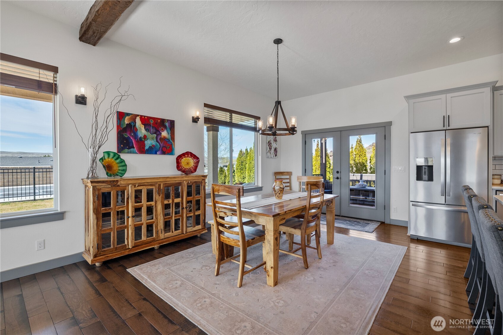 714 Sunset Boulevard Mattawa, WA 99349 - Photo 12 of 40 a dining room with furniture a chandelier and wooden floor