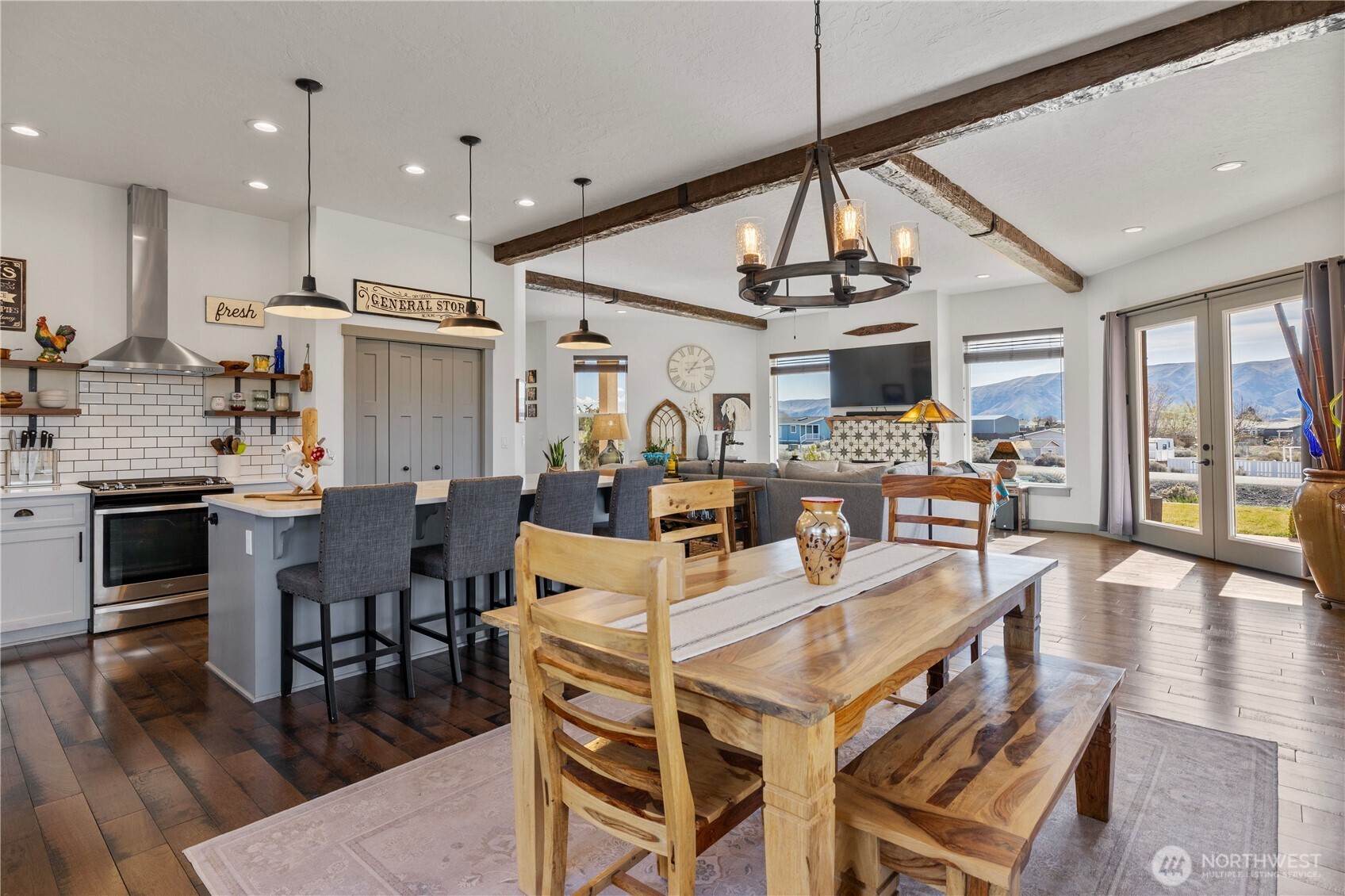714 Sunset Boulevard Mattawa, WA 99349 - Photo 13 of 40 a view of a dining room with furniture wooden floor and chandelier