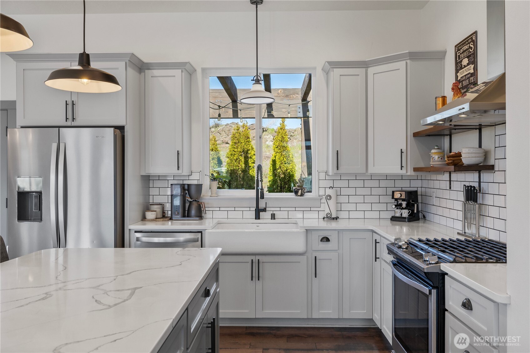 714 Sunset Boulevard Mattawa, WA 99349 - Photo 16 of 40 a kitchen with stainless steel appliances granite countertop a sink stove and refrigerator