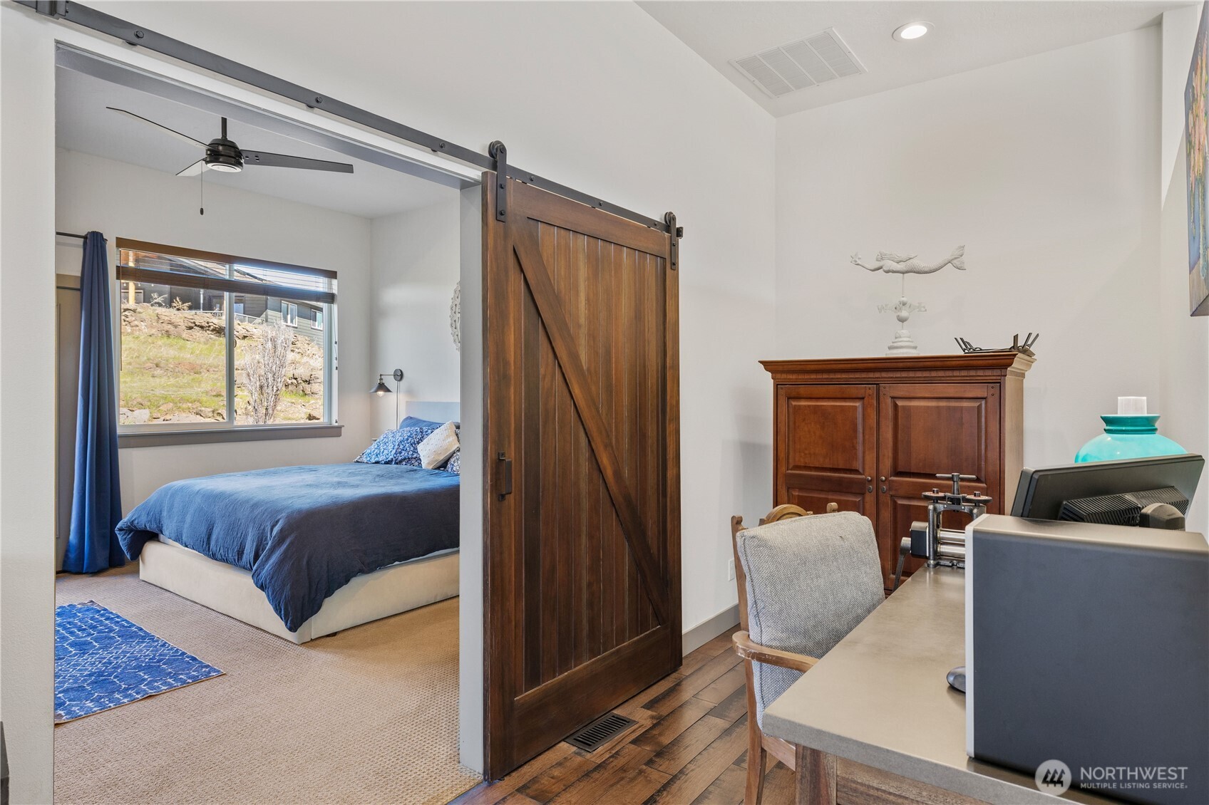 714 Sunset Boulevard Mattawa, WA 99349 - Photo 23 of 40 a bedroom with a bed and wooden floor