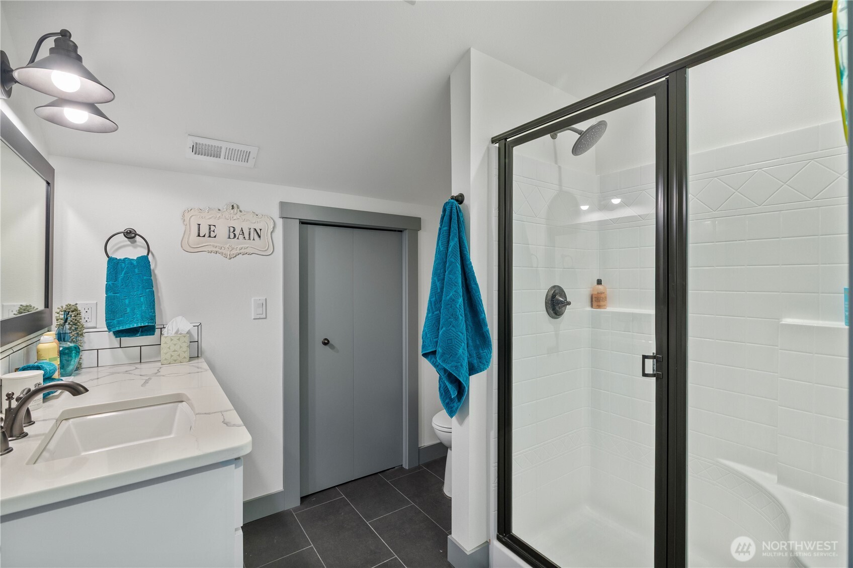 714 Sunset Boulevard Mattawa, WA 99349 - Photo 31 of 40 a bathroom with a sink a mirror and a shower
