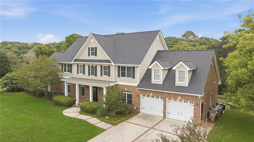4337 Mountain View Road Oakwood, GA 30566 - Photo 3 of 84 a front view of a house with garden