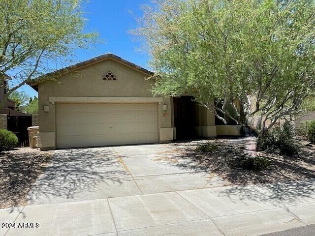 8478 West Maya Drive Peoria, AZ 85383 - Photo 2 of 6 a front view of a house with a yard