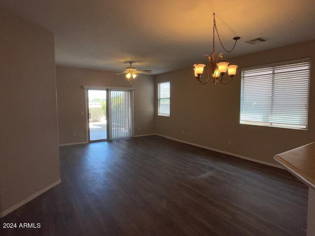 8478 West Maya Drive Peoria, AZ 85383 - Photo 4 of 6 an empty room with wooden floor and windows