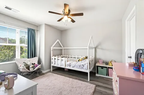 a bed room with furniture and a window