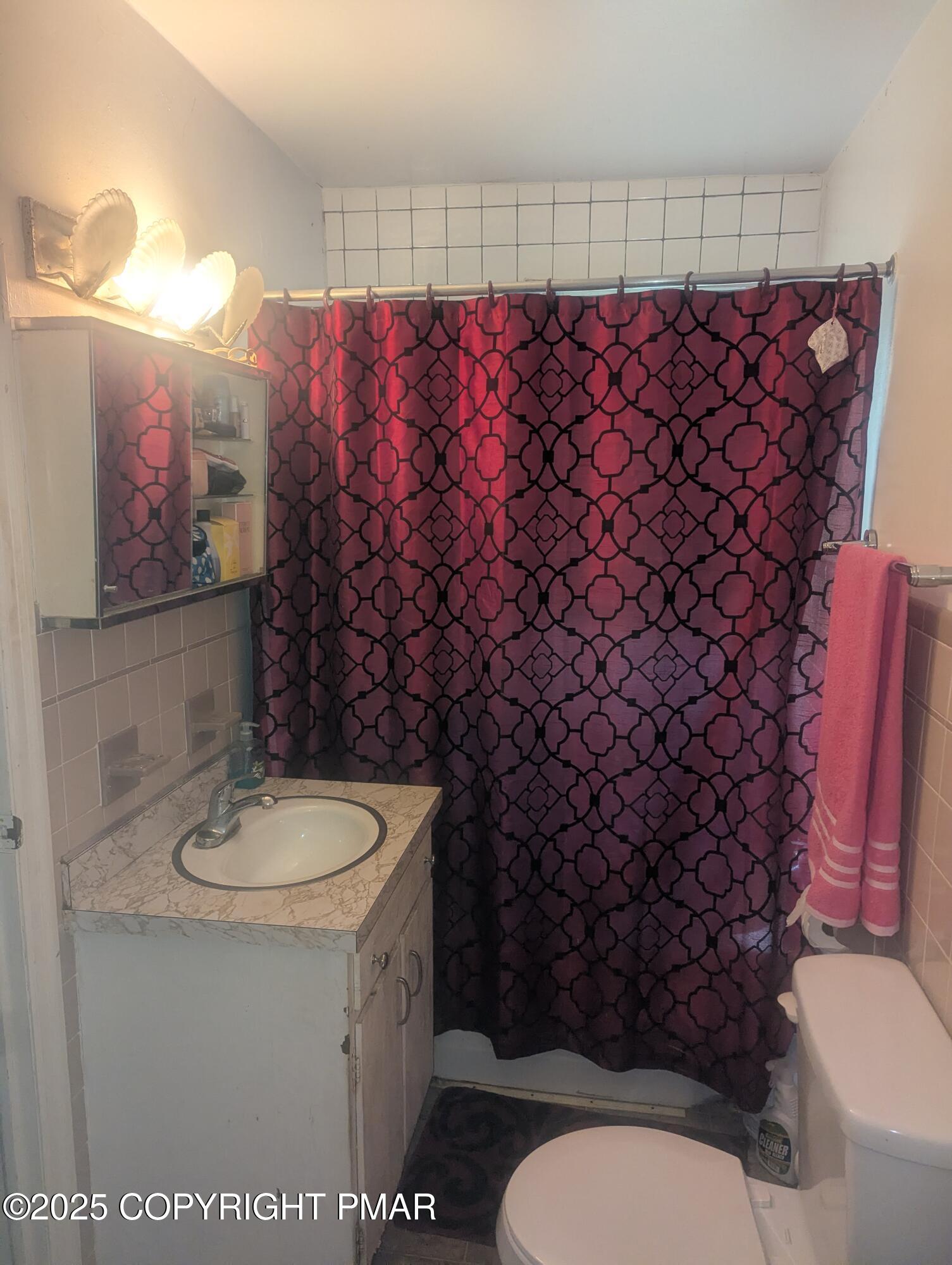 593 Pardee Street Hazleton, PA 18201 - Photo 13 of 17 a bathroom with a sink toilet and shower