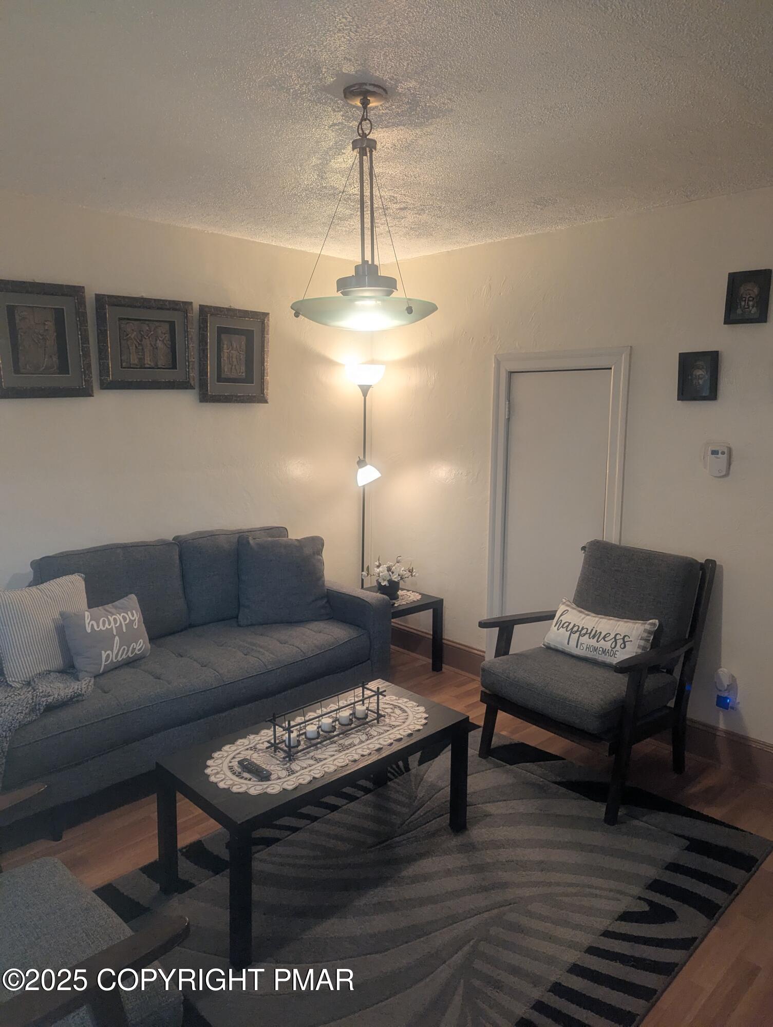 593 Pardee Street Hazleton, PA 18201 - Photo 2 of 17 a living room with furniture a window and a table