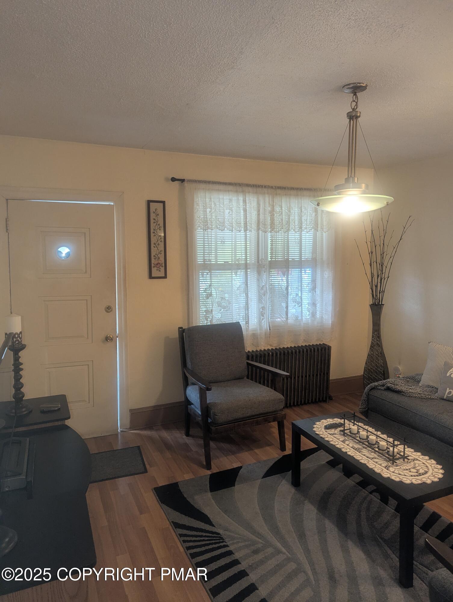 593 Pardee Street Hazleton, PA 18201 - Photo 3 of 17 a living room with furniture and a window