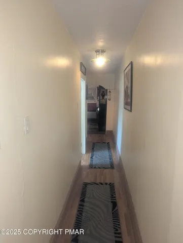 a room with a baby crib furniture and a dresser