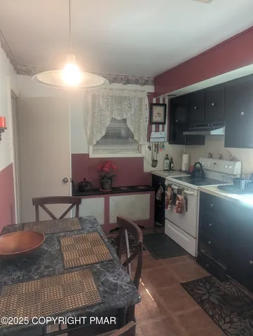 a bedroom with a bed and a potted plant