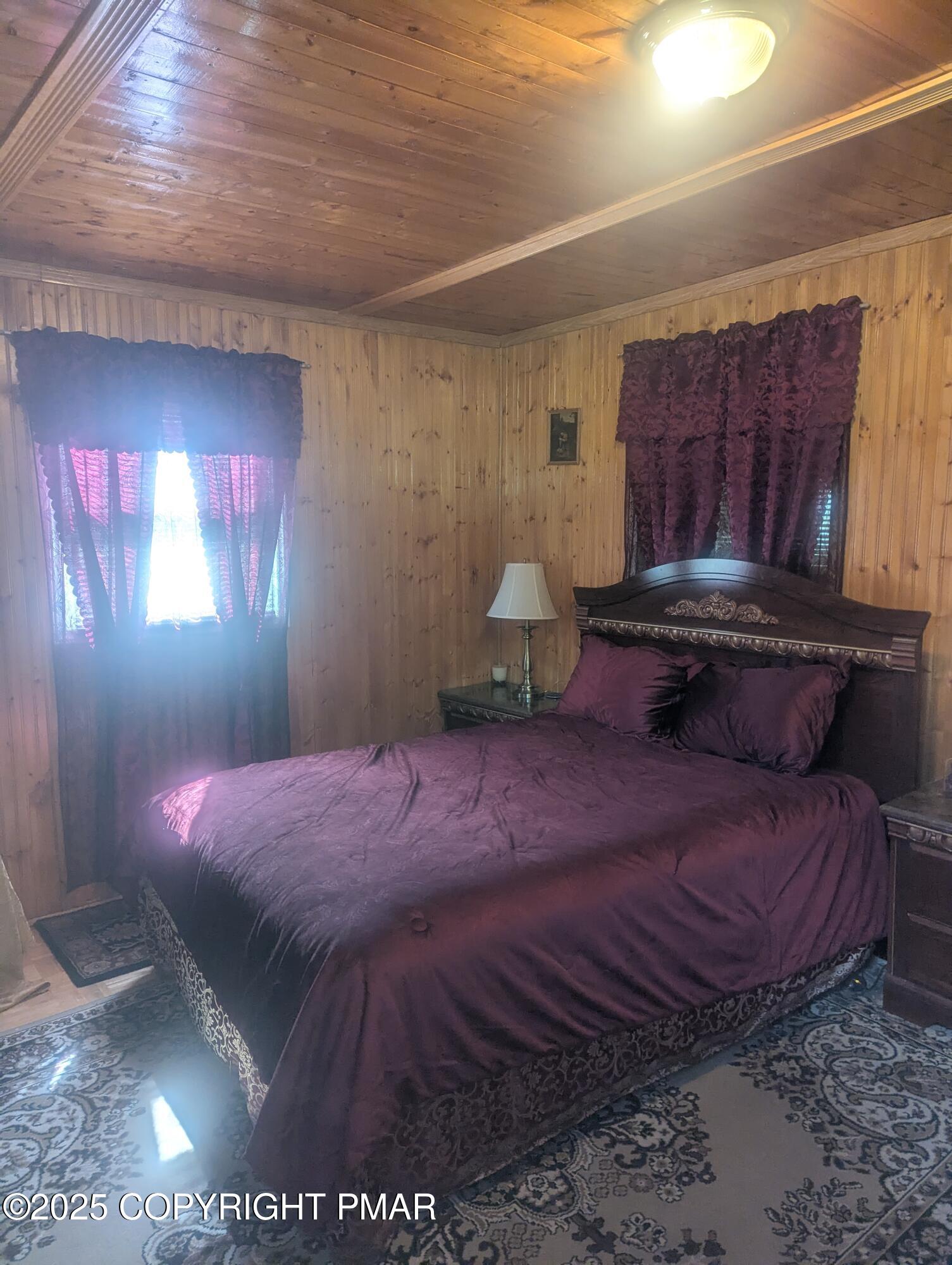 593 Pardee Street Hazleton, PA 18201 - Photo 9 of 17 a bedroom with a bed and a potted plant