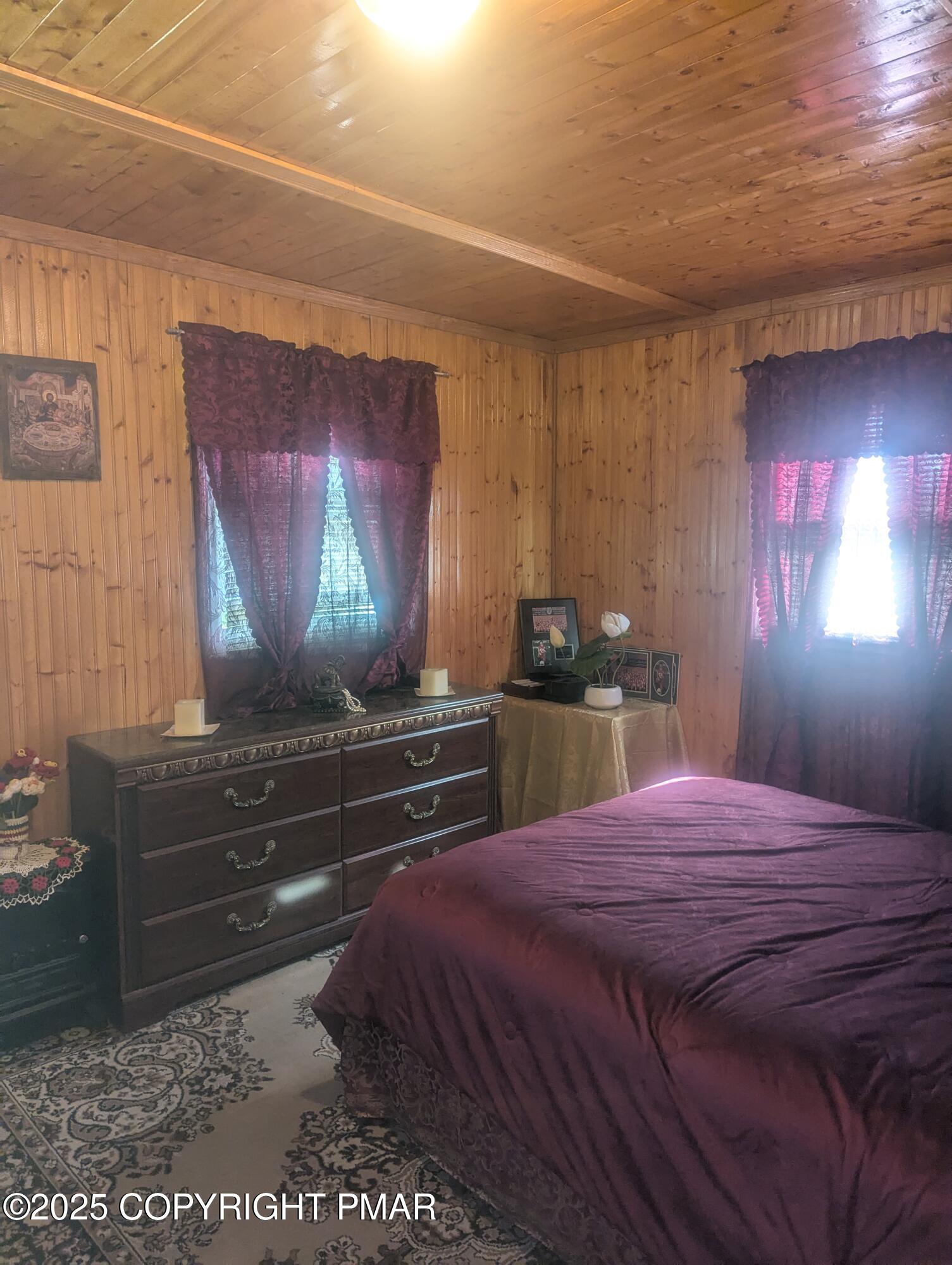 593 Pardee Street Hazleton, PA 18201 - Photo 10 of 17 a bedroom with a bed and a dresser with mirror