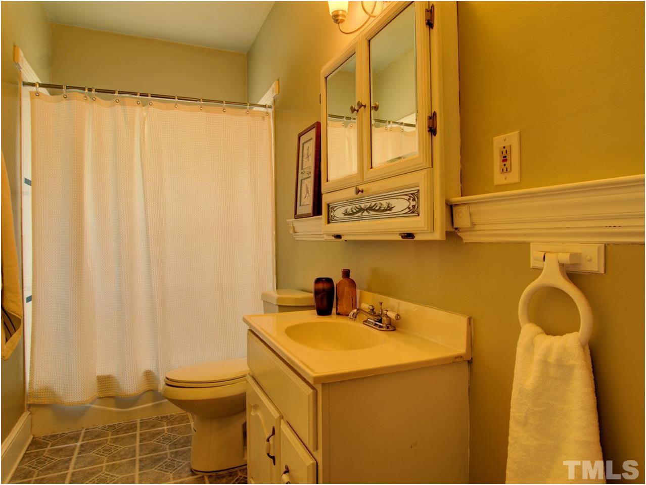 6708 Dwight Rowland Road Willow Spring, NC 27592 - Photo 14 of 20 This bath has a cool molding ledge that is perfect for displaying artwork. So charming.