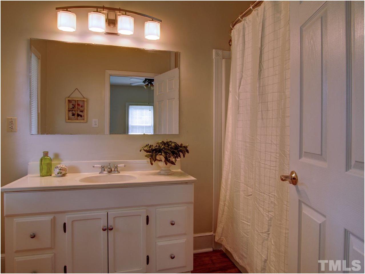6708 Dwight Rowland Road Willow Spring, NC 27592 - Photo 18 of 20 This is the master bath. Many of the older homes did not have a bath in the suite. You do. One of the other bedrooms has a half bath, and of course there's one more full bath outside.