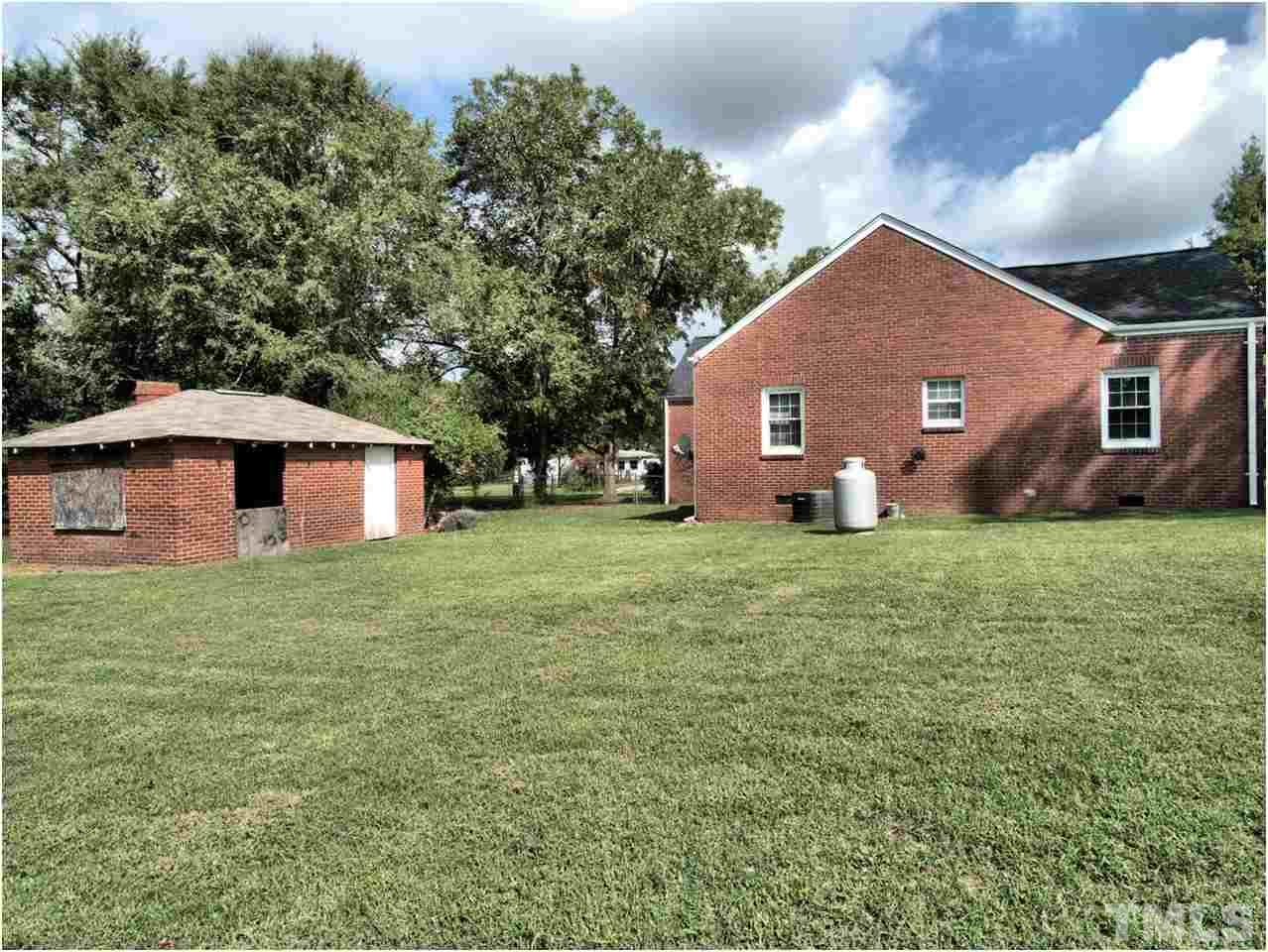 6708 Dwight Rowland Road Willow Spring, NC 27592 - Photo 19 of 20 This original wash house is a place to store extras, or redesign the space for a storage building or kids fort?