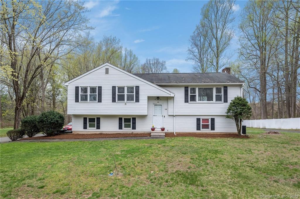 169 Ridge Road Madison, CT 06443 - Photo 1 of 1 a front view of a house with a yard