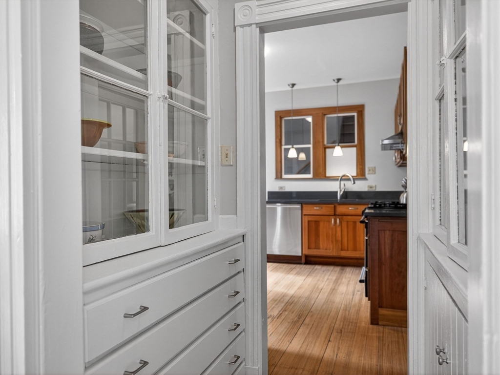 25 Danforth Street, Unit 3 Boston, MA 02130 - Photo 11 of 38 a view of a kitchen cabinets and a wooden floor